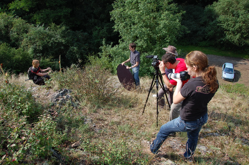 Filming crew outdoors.