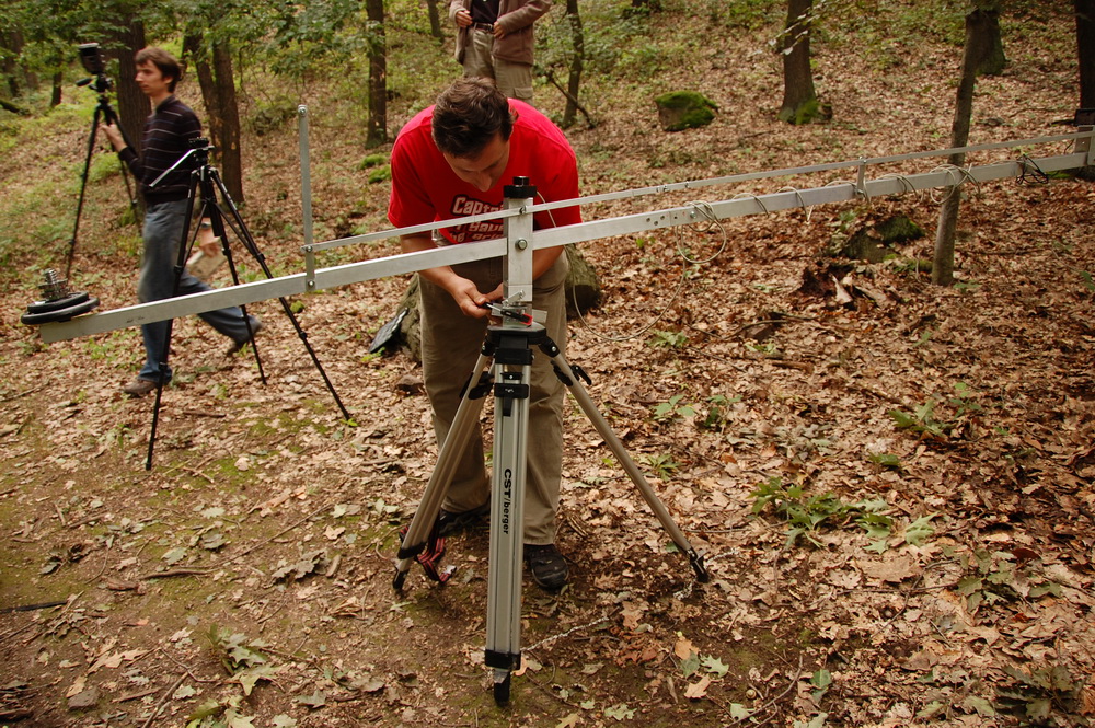 A camera crane in the forest.